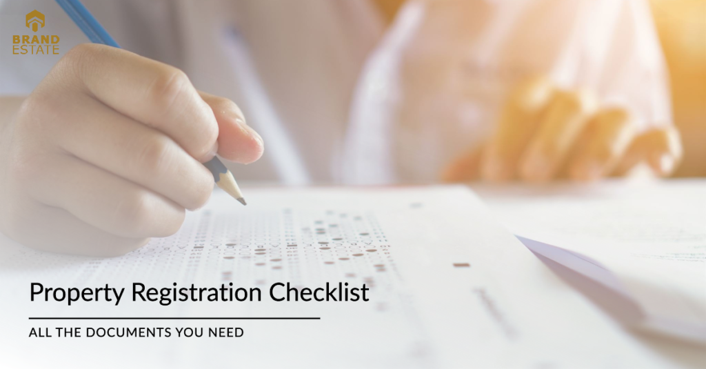 A document checklist graphic with a blue checkmark and property icons on a white background._brandestate.in